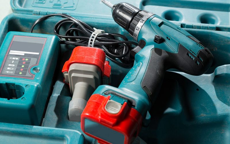 Cordless drill in case with battery and charger.